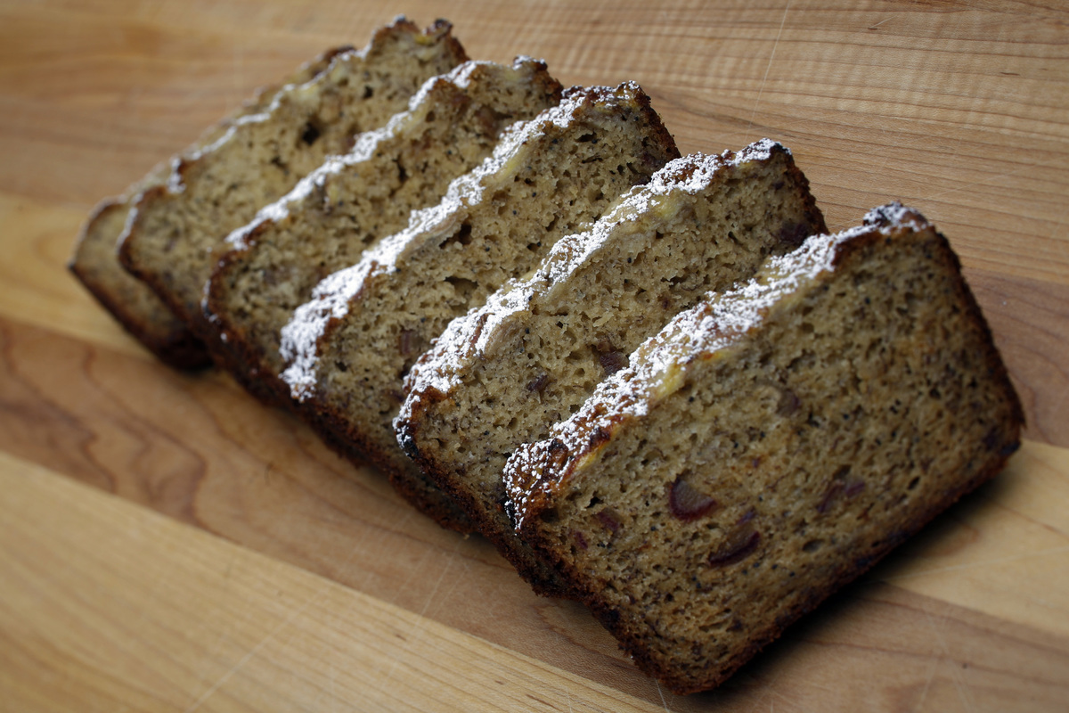 Banana bread from Huckleberry is laid out on a cutting board.