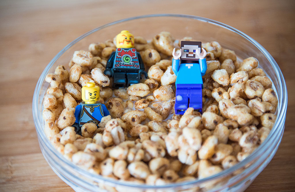 a bowl of cereal with lego minecraft toys inside