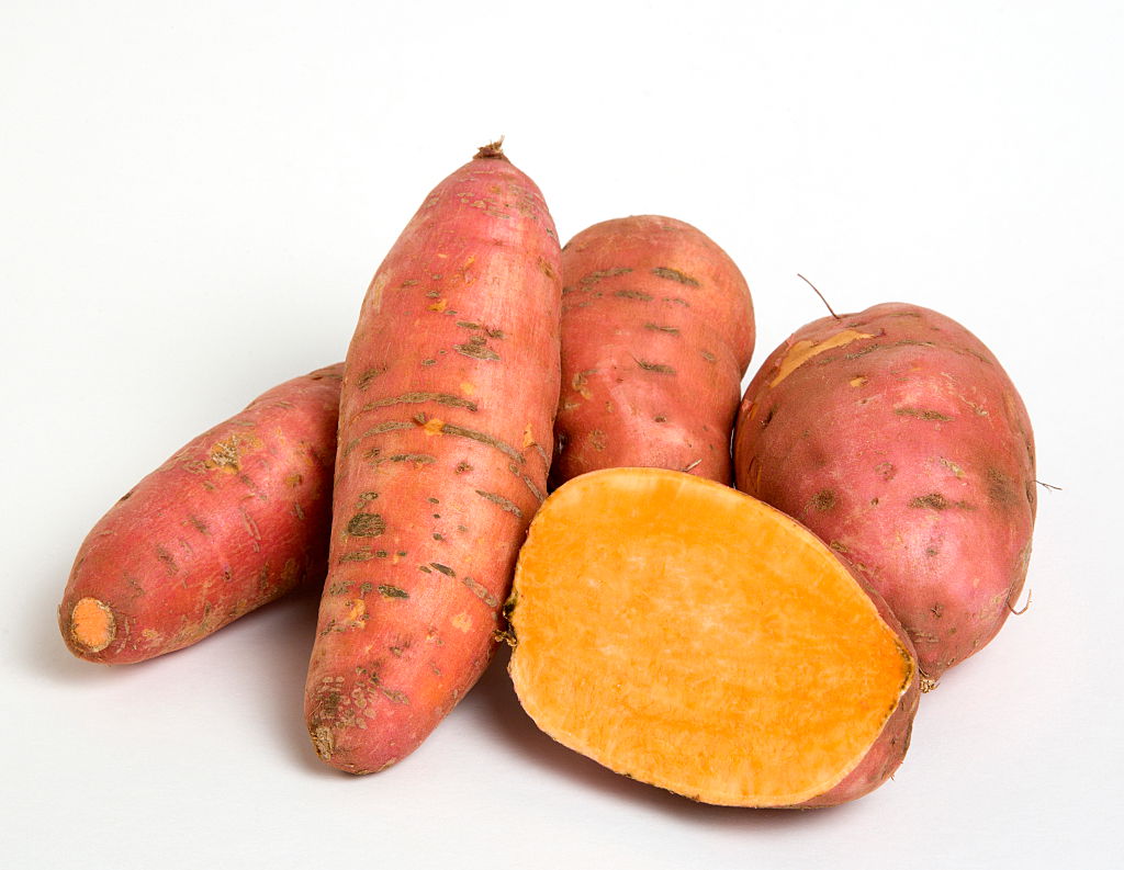 4 and a half sweet potatoes against a white background