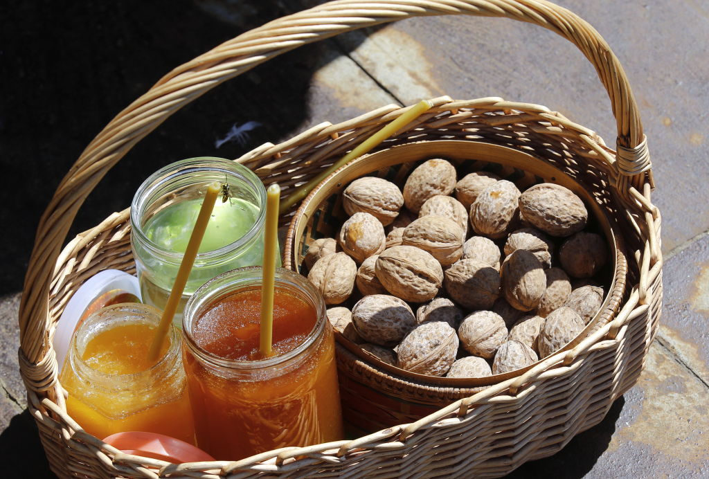 a basket with honey and walnuts